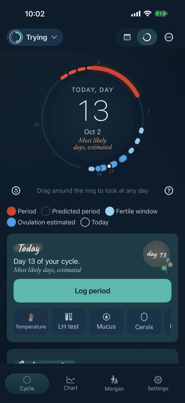 The Eva's Log cycle home while trying: a ring marking today as day 13 of the cycle, the period in coral, the fertile window and estimated ovulation in blue, and a Log period button